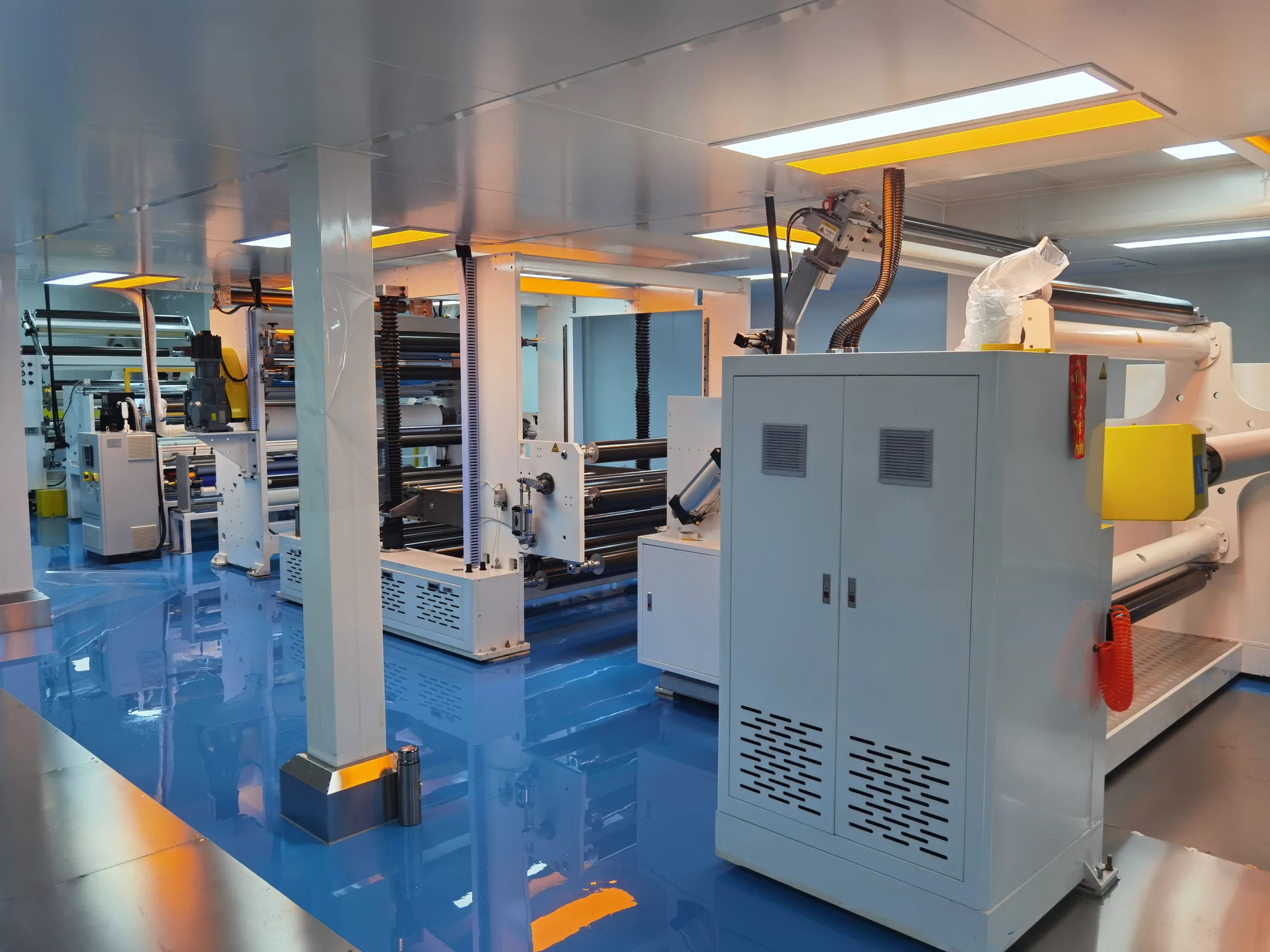 HDONE automotive film manufacturing production floor with coating equipment