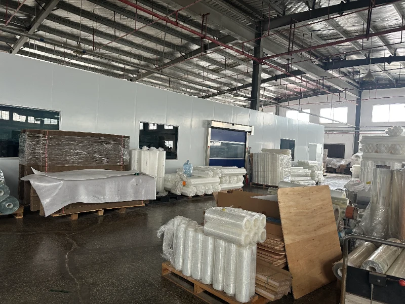 HOUDE automotive film factory materials storage area with coated film rolls in Dongguan, China